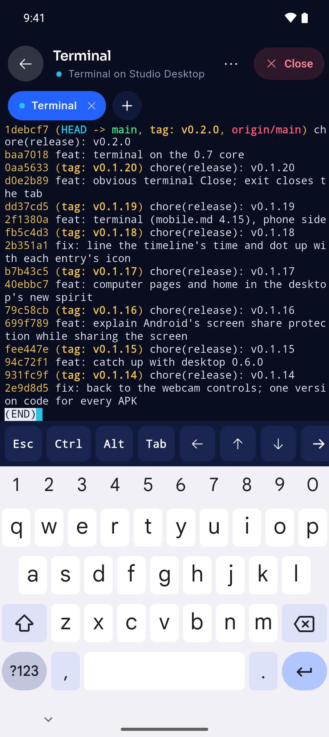 A terminal on Studio Desktop from the phone: git log in colour, with Esc, Ctrl, Alt, Tab and arrow keys above the keyboard